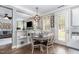 Sunlit eat-in kitchen shows an open view of the living room at 1209 Shasta Daisy Dr, Wake Forest, NC 27587