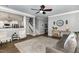 Open-concept living space featuring hardwood floors, neutral paint, and seamless flow to kitchen at 1209 Shasta Daisy Dr, Wake Forest, NC 27587