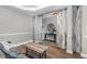 A cozy sitting area is shown with a decorative barn door element at 1209 Shasta Daisy Dr, Wake Forest, NC 27587