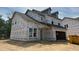 Two-story home featuring an attached garage, visible construction materials, and a traditional roofline at 1252 Randwick Valley Ct Ct, Zebulon, NC 27597