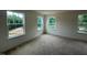 Carpeted bedroom with large windows offering great views at 1252 Randwick Vly Ct, Zebulon, NC 27597