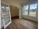 Bright office space with hardwood floors, glass doors, and natural light streaming through the windows at 1252 Randwick Vly Ct, Zebulon, NC 27597