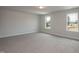 Carpeted room with ample natural light and exterior view at 127 High Hampton Way, Fuquay Varina, NC 27526