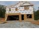 Image showing the framing stage of a new home's construction with wood and house wrap at 127 High Hampton Way, Fuquay Varina, NC 27526