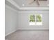 Spacious primary bedroom features a ceiling fan, carpet, and large windows at 127 High Hampton Way, Fuquay Varina, NC 27526