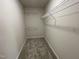 Walk-in closet with shelving and carpet at 127 Oakfield Trace Dr, Four Oaks, NC 27524
