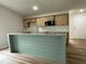 Beautiful kitchen with island featuring granite countertop, stainless steel appliances, and modern finishes at 127 Oakfield Trace Dr, Four Oaks, NC 27524