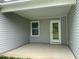 Covered back porch with vinyl siding and concrete floor at 127 Oakfield Trace Dr, Four Oaks, NC 27524