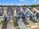 An elevated view features houses in a neat row, complete with driveways and trimmed green lawns at 1272 Brown Velvet Ln, Apex, NC 27523