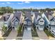 An aerial view of a neighborhood showcasing similar-style houses and well-maintained lawns at 1272 Brown Velvet Ln, Apex, NC 27523