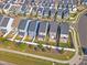 Aerial view showcasing the backyards of neighboring homes, complete with manicured lawns and patios at 1272 Brown Velvet Ln, Apex, NC 27523