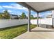 Backyard with covered patio, white fence, and well-maintained lawn, ideal for entertaining at 1272 Brown Velvet Ln, Apex, NC 27523