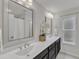 Bathroom featuring double sinks, large mirrors, and modern fixtures at 1272 Brown Velvet Ln, Apex, NC 27523
