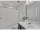 Bright bathroom featuring a vanity with storage and a shower with tub at 1272 Brown Velvet Ln, Apex, NC 27523