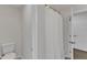 Bright bathroom featuring a bathtub with shower and white walls at 1272 Brown Velvet Ln, Apex, NC 27523