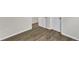 Wood-look floors with view of the base trim and paneled doors at 1272 Brown Velvet Ln, Apex, NC 27523