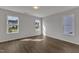 Bedroom featuring hardwood floors, neutral walls, and bright natural light at 1272 Brown Velvet Ln, Apex, NC 27523