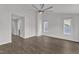 Bright bedroom featuring hardwood floors, light, neutral walls, and multiple windows at 1272 Brown Velvet Ln, Apex, NC 27523
