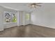 Bedroom featuring hardwood floors, a ceiling fan, and bright natural light at 1272 Brown Velvet Ln, Apex, NC 27523