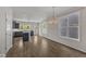 Bright dining area featuring hardwood floors and modern pendant lighting at 1272 Brown Velvet Ln, Apex, NC 27523