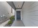 Inviting entryway featuring a stylish front door and modern exterior lighting at 1272 Brown Velvet Ln, Apex, NC 27523