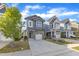 Beautiful gray two-story home with a well-manicured lawn and a spacious driveway at 1272 Brown Velvet Ln, Apex, NC 27523