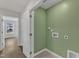 Hallway with olive green accent wall for laundry connections at 1272 Brown Velvet Ln, Apex, NC 27523