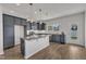 Modern kitchen featuring a center island, stainless steel appliances, and gray cabinetry at 1272 Brown Velvet Ln, Apex, NC 27523