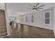 Spacious open-concept living area with hardwood floors and staircase access at 1272 Brown Velvet Ln, Apex, NC 27523