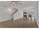 Bright, open-concept living space with hardwood floors and staircase at 1272 Brown Velvet Ln, Apex, NC 27523