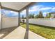 Covered patio overlooking a well-maintained fenced backyard, perfect for outdoor relaxation at 1272 Brown Velvet Ln, Apex, NC 27523