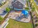 Community playground features a blue-covered climbing area, swings, a sand pit, and picnic tables at 1272 Brown Velvet Ln, Apex, NC 27523