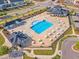 A beautiful community pool offers a refreshing escape, surrounded by comfortable lounge chairs and tables at 1272 Brown Velvet Ln, Apex, NC 27523