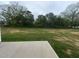 Backyard of a home featuring a grassy area and trees at 139 Oakfield Trace Dr, Four Oaks, NC 27524
