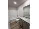 Modern bathroom with vanity, sink, granite countertop, shower and bathtub at 139 Oakfield Trace Dr, Four Oaks, NC 27524
