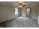 Bedroom featuring gray carpet, a ceiling fan, and a window at 139 Oakfield Trace Dr, Four Oaks, NC 27524
