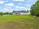 Large, well-maintained backyard with a pool, deck, and plenty of space for recreation at 140 Crystal Pl, Benson, NC 27504