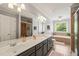 Bathroom featuring double sinks, gray cabinetry, and separate shower and tub at 140 Crystal Pl, Benson, NC 27504
