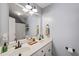 Bright bathroom featuring double sinks, a large mirror, and modern fixtures at 140 Crystal Pl, Benson, NC 27504