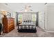 Bedroom featuring carpet, ceiling fan, and a bed with matching nightstands and a large dresser at 140 Crystal Pl, Benson, NC 27504