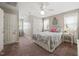 Comfortable bedroom featuring carpet, ceiling fan, and a quilt-covered bed flanked by matching nightstands at 140 Crystal Pl, Benson, NC 27504