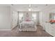Charming bedroom with a comfortable bed, ceiling fan, neutral walls, and carpet flooring at 140 Crystal Pl, Benson, NC 27504