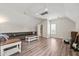 Spacious bedroom featuring wood floors, neutral walls, vaulted ceiling, and comfortable seating at 140 Crystal Pl, Benson, NC 27504
