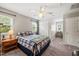 Bedroom featuring carpet, ceiling fan, and a bed with matching nightstands at 140 Crystal Pl, Benson, NC 27504