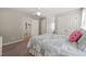 Bedroom featuring carpet, ceiling fan, and a quilt-covered bed with closets and an ensuite at 140 Crystal Pl, Benson, NC 27504