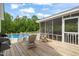 Relaxing screened-in porch and deck area with pool views for enjoying the outdoors at 140 Crystal Pl, Benson, NC 27504