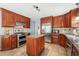 Stylish kitchen featuring an island, stainless steel appliances, and custom cabinetry at 140 Crystal Pl, Benson, NC 27504