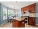 Beautiful kitchen with an island, stainless steel appliances, and a breakfast nook with ample natural light at 140 Crystal Pl, Benson, NC 27504