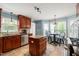 Charming kitchen featuring an island, stainless steel appliances, and a breakfast nook with bright windows at 140 Crystal Pl, Benson, NC 27504
