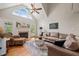 Spacious living room with a fireplace, vaulted ceiling, and ample natural light at 140 Crystal Pl, Benson, NC 27504